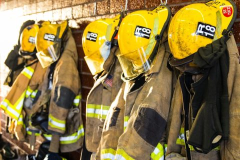 Essential Questions About Rapid Fire Watch Support for Texas Businesses Firefighter helmets and uniforms hanging on a wall